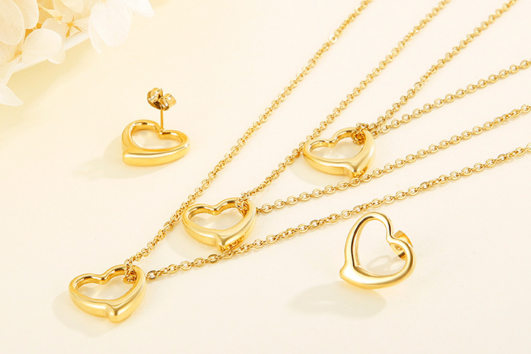 hollow heart-shaped three-layer necklace clavicle chain earrings set titanium steel set