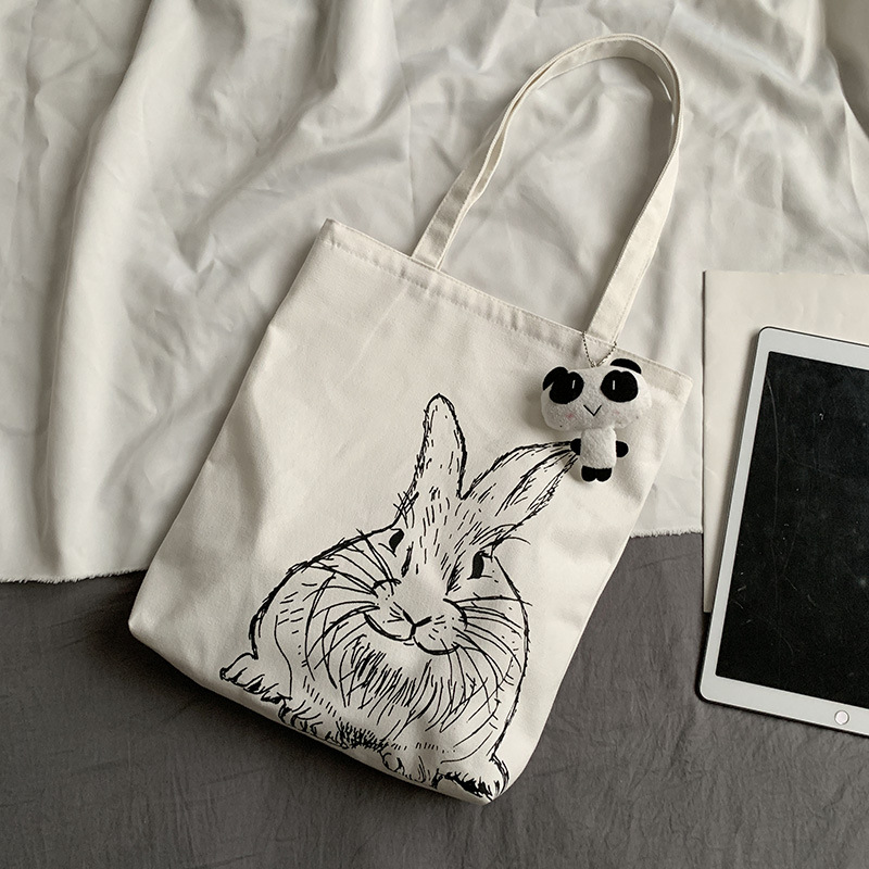 Bolsa de lona femenina estudiante de un solo hombro japonés ins bolsa de tela impresa de dibujos animados lindo de gran capacidad
