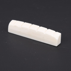 Factory-direct cowbone acoustic guitar, folk guitar—featuring both a cowbone saddle and bridge, as well as a cowbone lower string nut.