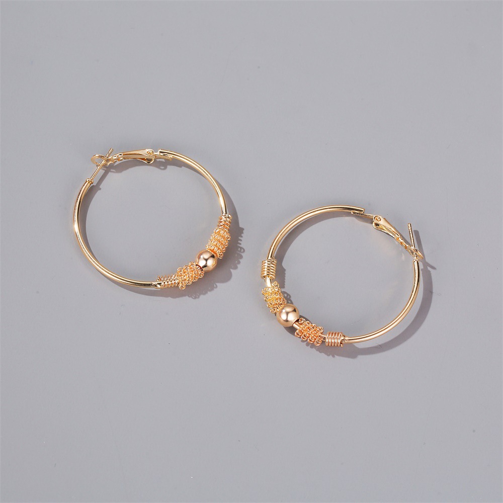 Korean Fashion Sense Of Fake Winding Bead Earrings Temperament Simple Geometric Hollow Circle Earrings Ear Buckle Wholesale display picture 5