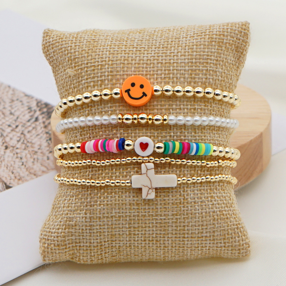 Fashion Trend Natural Pearl Soft Ceramic Multi-layered Beaded Imported Color-preserving Gold Bead Letter Bracelet display picture 3