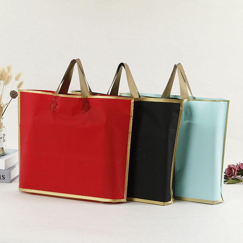 厂家批发现货EVA金边框系列手提袋塑料服装袋购物袋1包50个起批