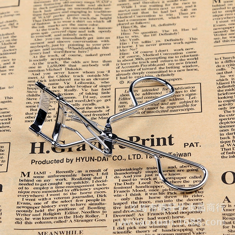 Curling cosmetic eyelash curler for eyelashes