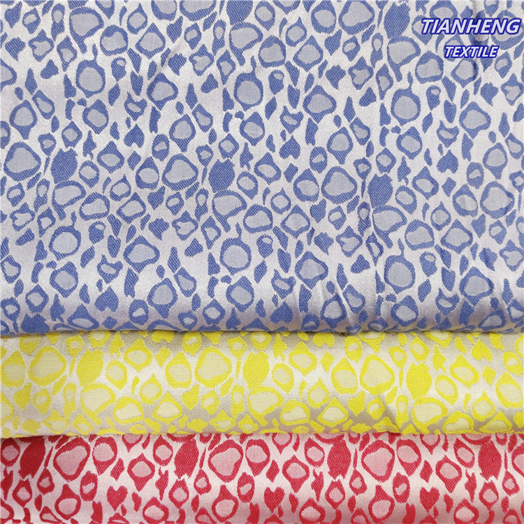 涤纶纬弹豹点提花女装童装外套西装连衣裙古装戏服舞台服饰面料