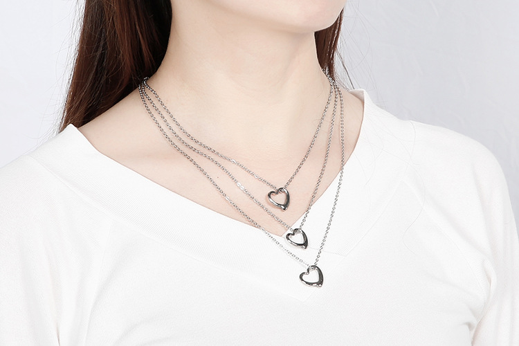 hollow heart-shaped three-layer necklace clavicle chain earrings set titanium steel set