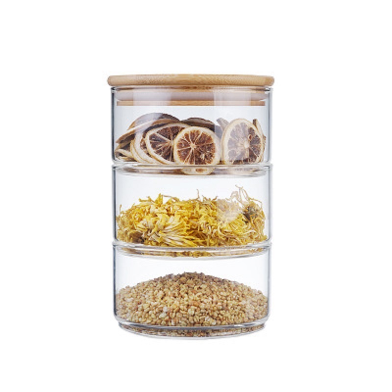 Fábrica al por mayor de bambú cubierta de vidrio ensaladera borosilicato vidrio resistente al calor Sellado tarro de alimentos de grano