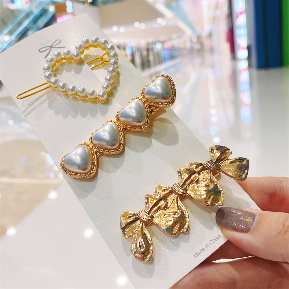 Korean Style Bow Metal Pearl Heart-shape Alloy Hairpin display picture 1