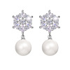 Zirconium from pearl, fashionable earrings, with snowflakes