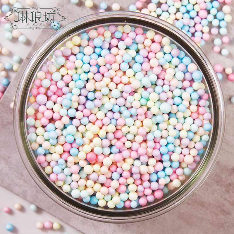 Macaron color bola de espuma TikTok caja de regalo flujo de partículas planeta caja de regalo Internet celebridad relleno 25g ventas directas de fábrica