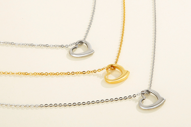 hollow heart-shaped three-layer necklace clavicle chain earrings set titanium steel set