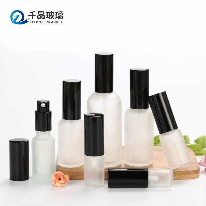 Botella de aceite esencial esmerilado transparente al por mayor 30ml cabeza de bomba de loción de pulverización de aluminio electroquímico negro 50ml subbotella cosmética
