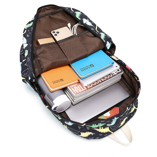 Cross-border elementary school student dinosaur schoolbag female cute cartoon three-piece backpack middle school student light spine protection backpack male