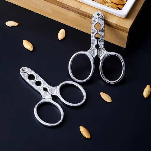 Factory direct sales zinc alloy melon seed clip to peel melon seeds and peelers to open melon seeds and pine nuts for lazy people to eat watermelon seeds and pine nuts.