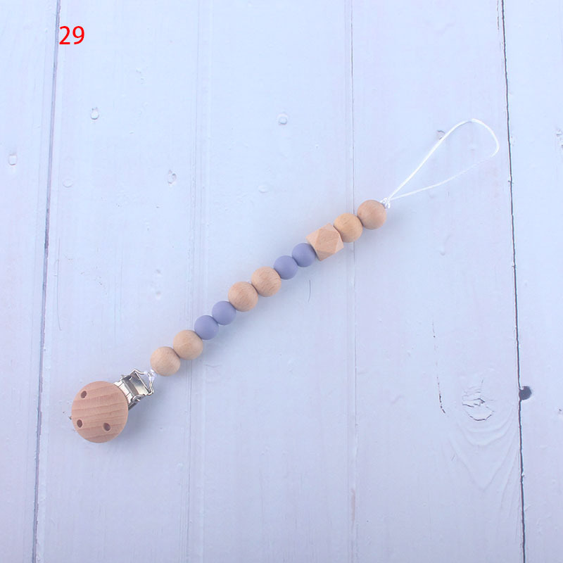 Nueva fábrica directa bebé Beech juguete mordedor bebé chupete de silicona pezón anti-gota cadena materna y infantil suministros