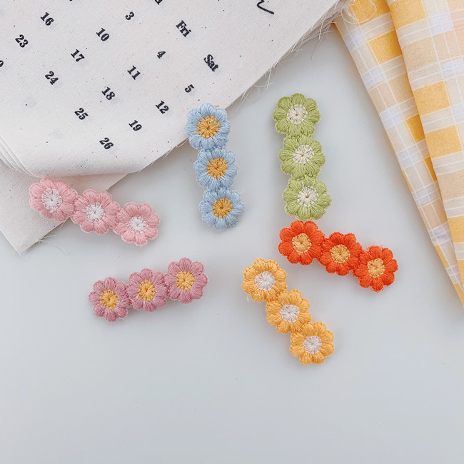 Korean Small Daisy Flower Wool Edge Clip Candy Color Bangs Hairpin Wholesale display picture 10