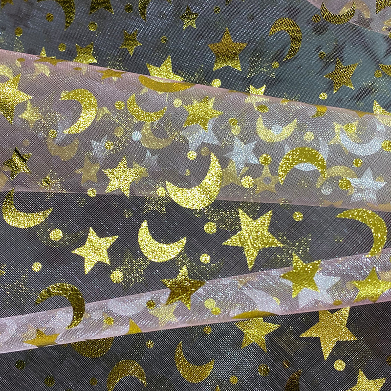 Fabricante suministro de ergena estrellas de la luna estampado tela de red de embalaje de boda bolsa tela de vestido