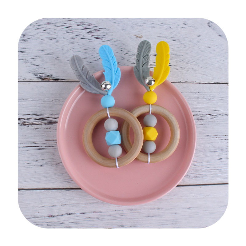 Nueva historieta DIY Hemu anillo de mano sonajero juguete mordedor infantil cuentas de plumas de silicona dientes de molienda palo