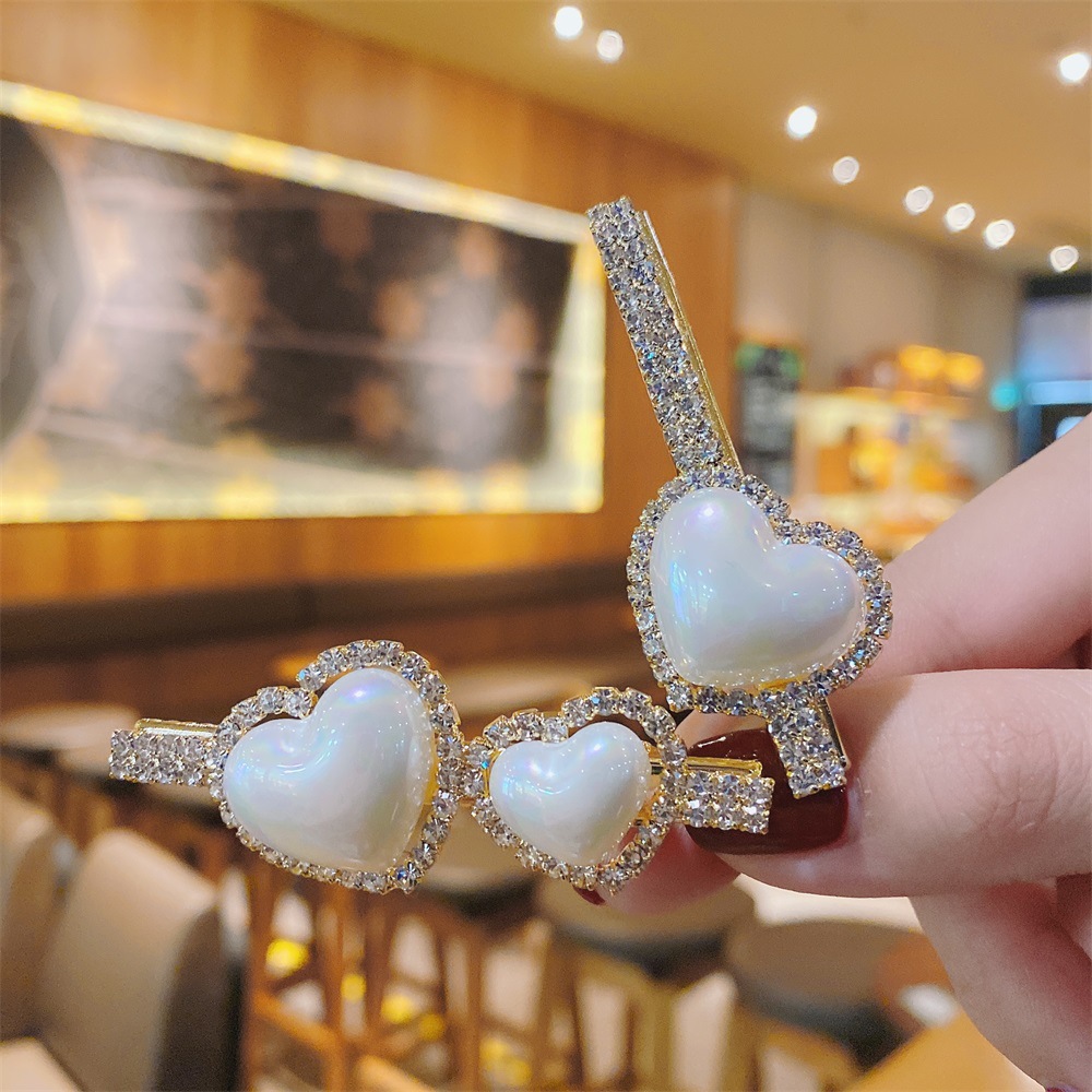 Korea Hair Accessories Imitation Pearl Heart Hairpin Simple Rhinestone Duckbill Clip display picture 3