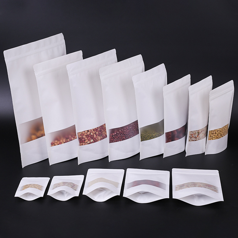 Factory-made white kraft paper bags with self-sealing and transparent window packaging—stand-up, resealable bags for food packaging.