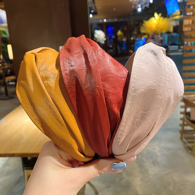 140g Weight Headwear Classification Festival Occasion Pu Leather Material Geometric Pattern Women'S Gender Khaki, Beige, Pink, Green, Blue, Wine Red, Yellow, Black Color Simple Style Wide-brimmed Cross Solid Color Leather Headband Wholesale 3