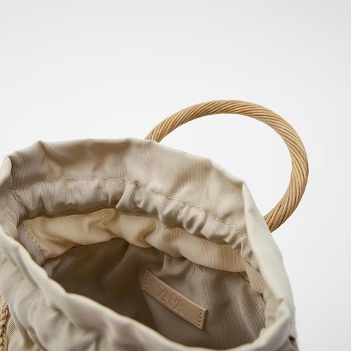 Manufacturer source artificial pearl decoration new straw woven bag trendy women's bag flower hand basket bag woven bag