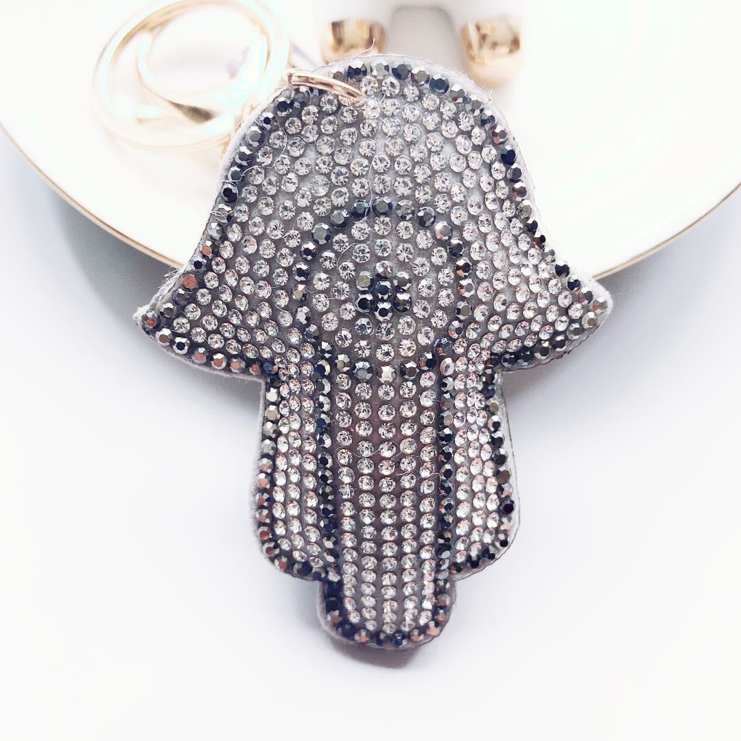 Venta caliente transfronteriza de Palma llavero coreano terciopelo rhinestone gato ojo llavero bolsa colgante accesorios en stock
