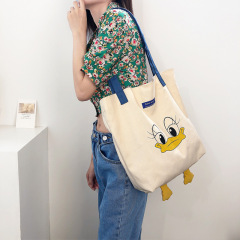 Pick flowers cloth language / 2020 new Ins small yellow duck large capacity hand-held bag leisure color-matching versatile single-shoulder canvas bag