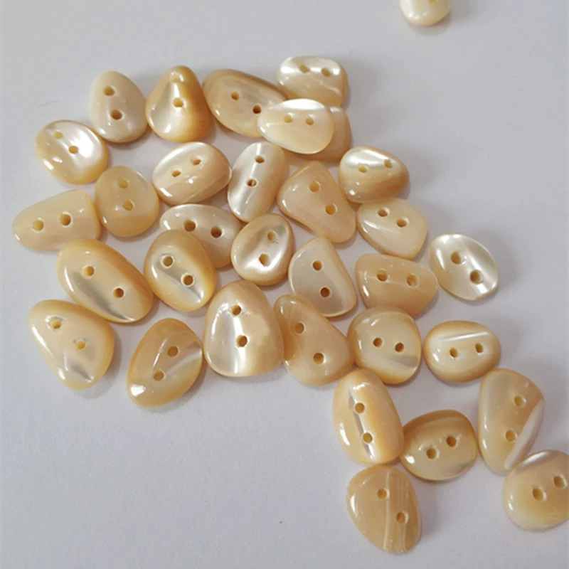 High -end natural alien shell button white shirt knit sweater irregular cobblestone oval shell button