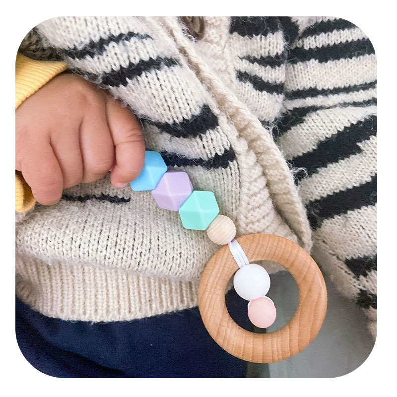 Nueva historieta DIY haya anillo mano palo juguete mordedor bebé cuentas de silicona dientes molienda palo Amazon nuevo