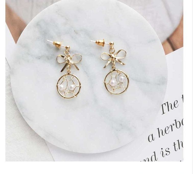 Fashion Geometric Solid Color Hollow Bow Pearl Earrings display picture 2