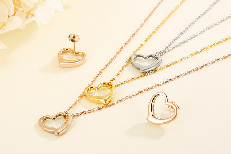 hollow heart-shaped three-layer necklace clavicle chain earrings set titanium steel set