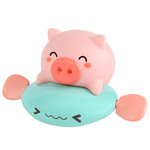 Children's wind-up piglet rides a flying fish, baby pulls a string and plays in the water, a whale dinosaur rides a flying fish, takes a bath, sprays water and swims toy