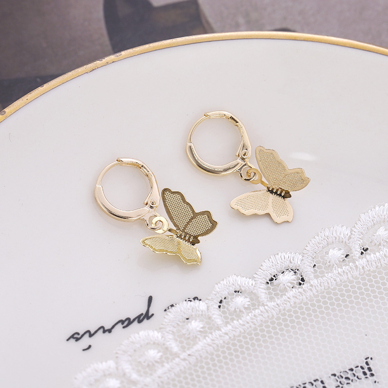 Cruz-frontera nuevos pendientes de mariposa accesorios personalidad de la moda europea y americana exagerada hueco mariposa pendientes gancho de La Oreja femenina