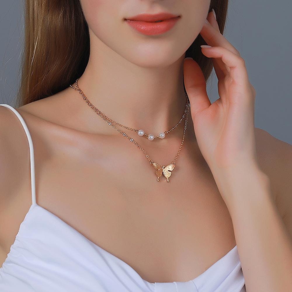 Neue Perle Doppelschicht Einfache Schmetterling Anhänger Lange Halskette display picture 2