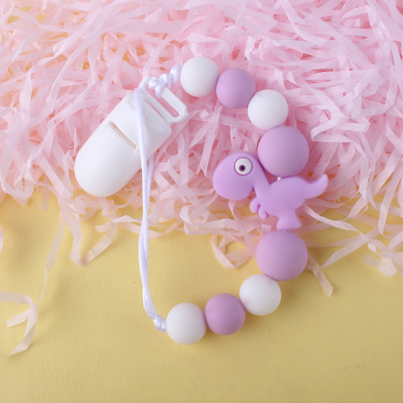 Pequeño dinosaurio bebé silicona pezón clip Cadena de dientes de bebé Cadena de molienda cadena anti-gota calmante teether pezón