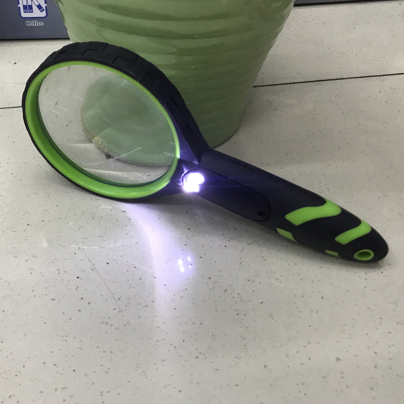 Two-color glass handheld lens