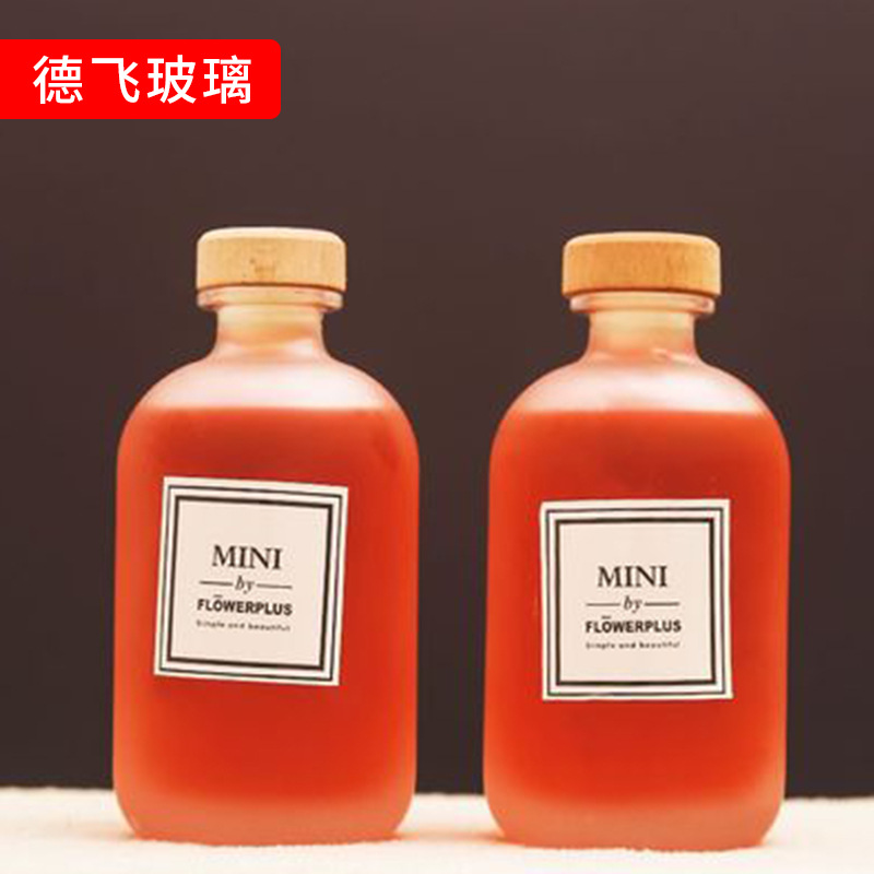 新款饮料，果酒白酒玻璃瓶简约蒙砂无铅饮料瓶可定制logo奶茶玻璃