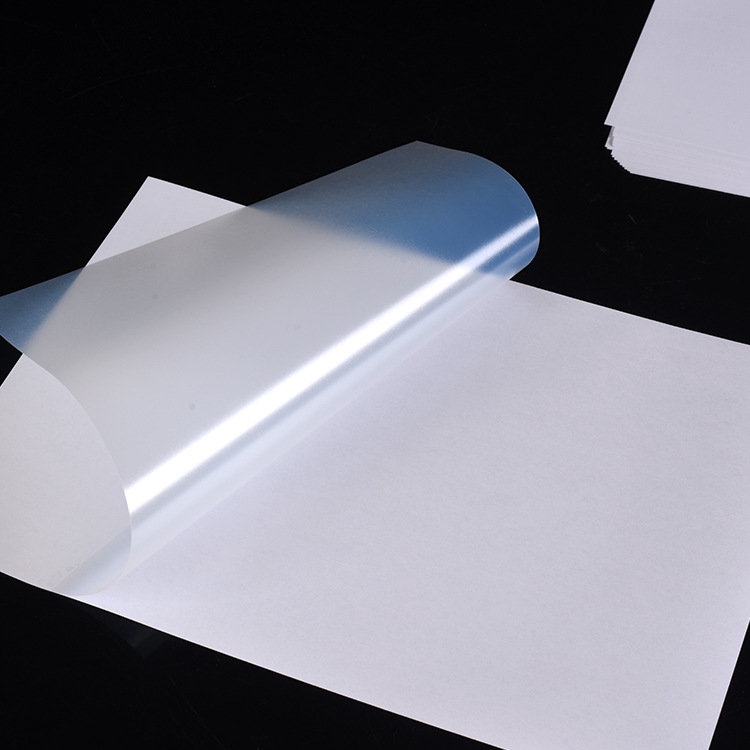 Los fabricantes suministran a prueba de agua PET adhesivo translúcido PET papel de etiqueta transparente de impresión láser de inyección de tinta