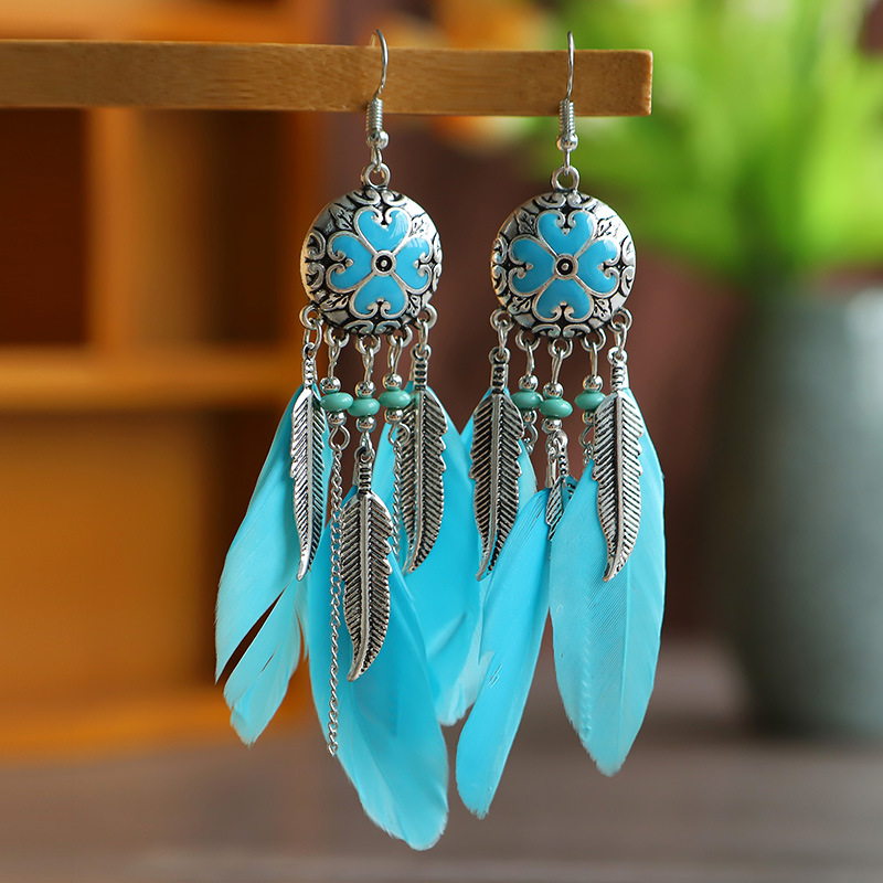 Vintage Exaggerated Round Feather Long Creative Rice Bead Carved Tassel Earrings display picture 5
