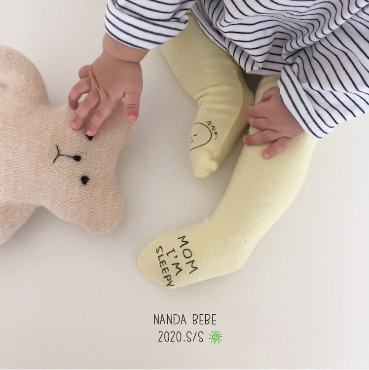 Otoño ins Corea del Sur mismo estilo bebé algodón bottoming pantimedias bebé lindo Smiley cara asimétrica pantimedias