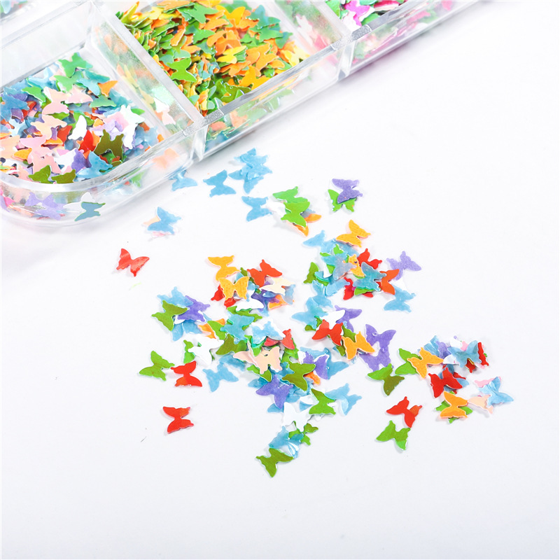 Transfronterizo caliente 12-color mezclado lentejuelas de uñas láser Magic Star Butterfly fluorescente DIY decoración de uñas lentejuelas