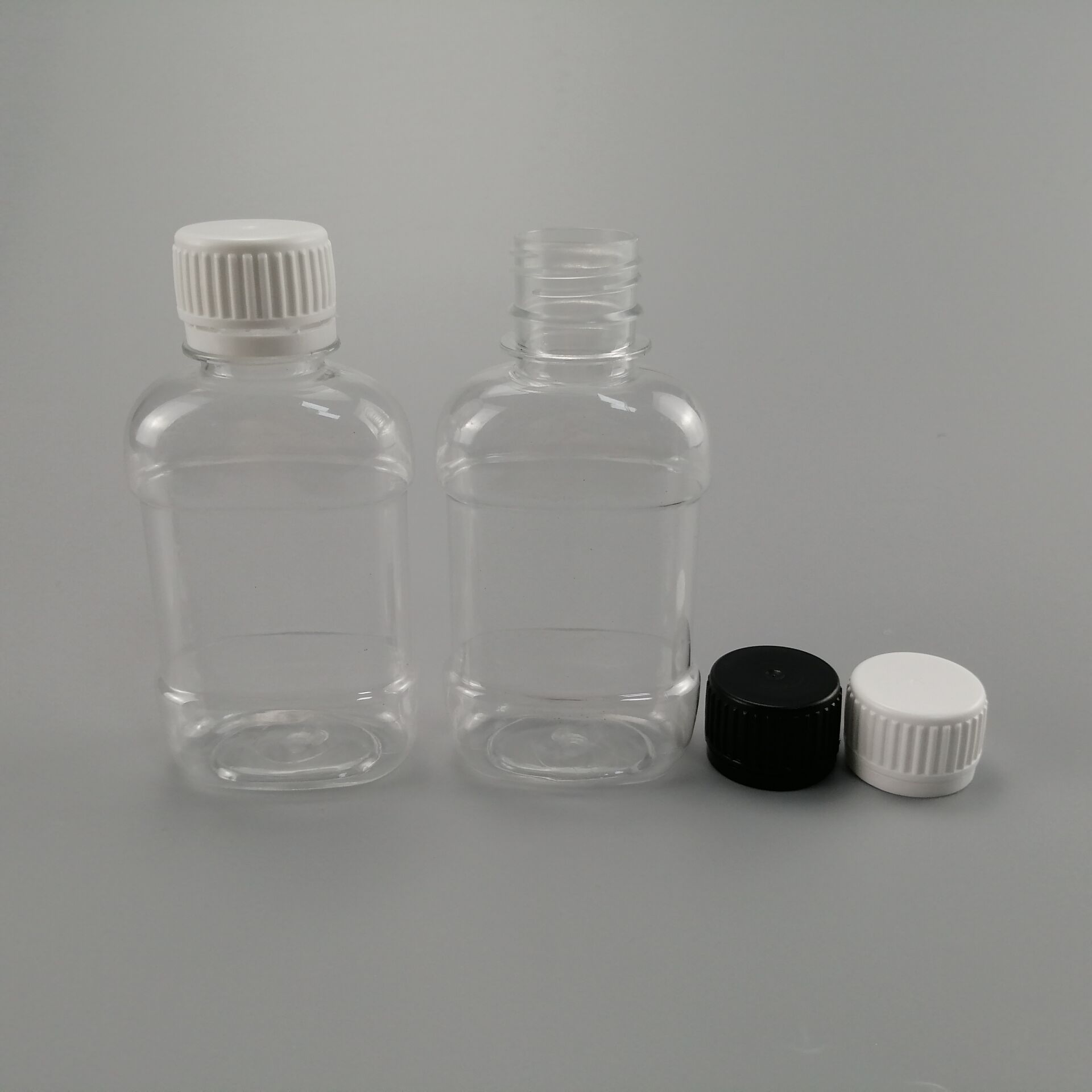 供应高档PET带量杯漱口水瓶100ML塑料瓶