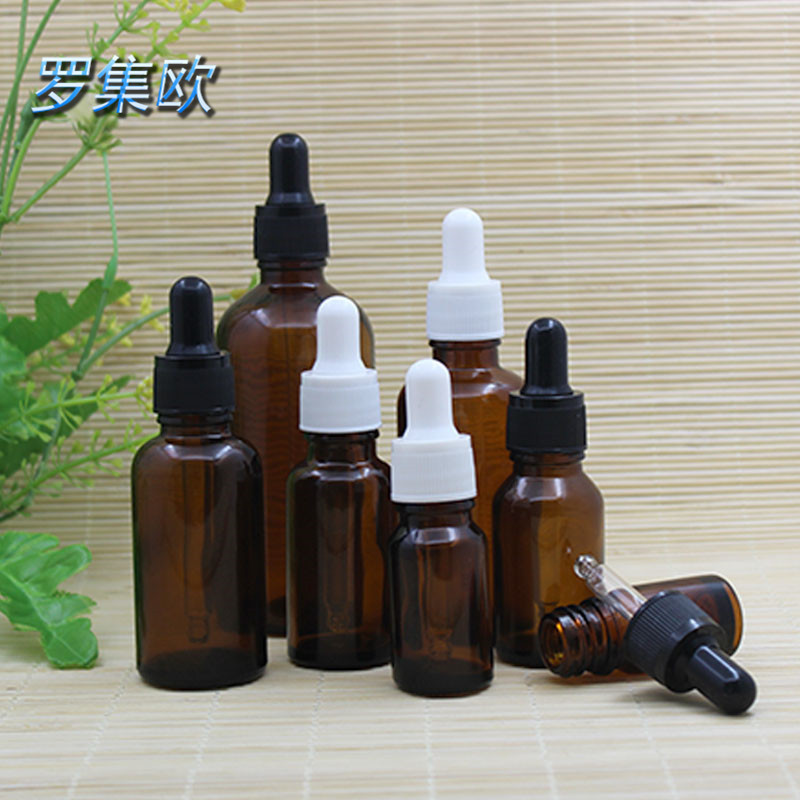 Brown botella de aceite esencial perfume gotero botella de prensa cosmético de vidrio sub-embalaje marrón mezcla botella vacía cabeza de goma de grano fino negro