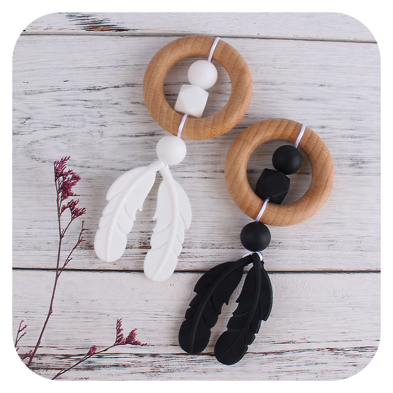 Nueva historieta DIY Beech anillo de mano molar de juguete mordedor infantil pluma de silicona perlas dientes de molienda palo