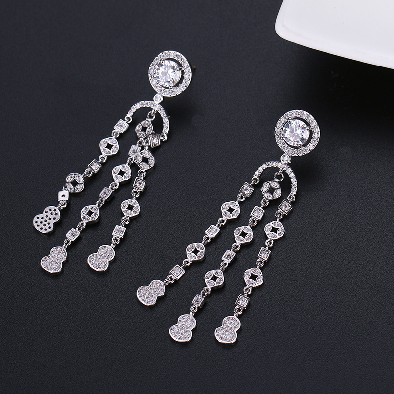 Long geometric earrings with zircon with tassels