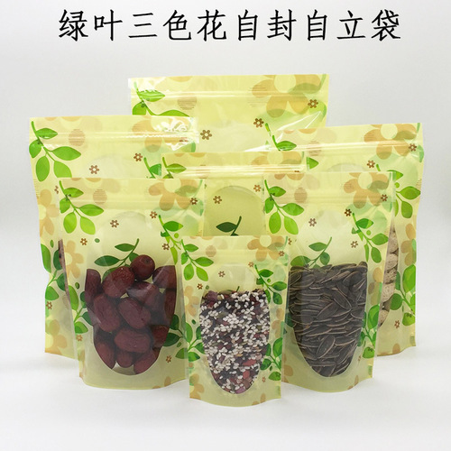 Factory direct sales green leaf three-color flower self-sealing self-standing bag flower tea sealing bag dried fruit and grain food packaging bag
