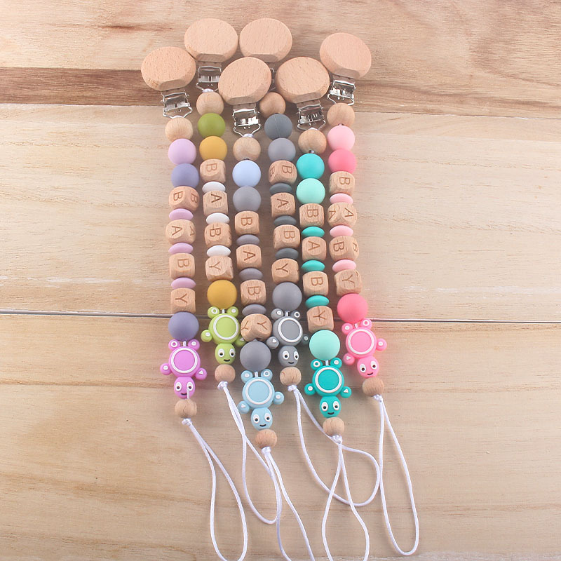 Bebé haya juguete mordedor tortuga chupete de silicona cadena AliExpress Amazon Venta caliente mordedor traje