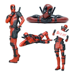 Deadpool figure X-Men prone pose desk toy action figure holding a sign looking back mischievous toy doll