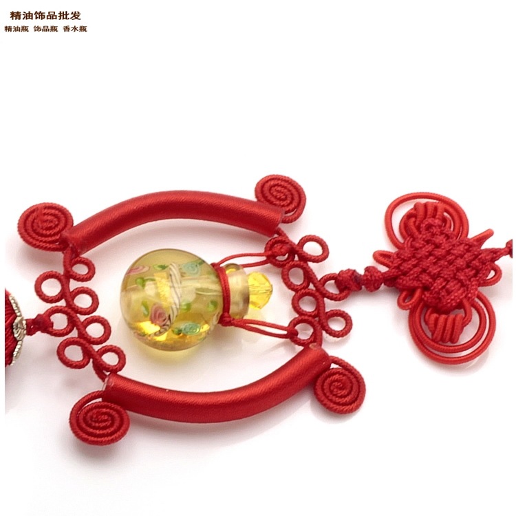 中国精油饰品网金黄色水中花琉璃精油瓶车挂1.jpg