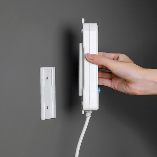 Creative power strip holder Home wall punch-free power strip strong traceless adhesive wall-mounted